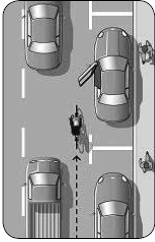 Image showing bicyclist riding far enough away from a parked vehicle to avoid being hit by an opening door.