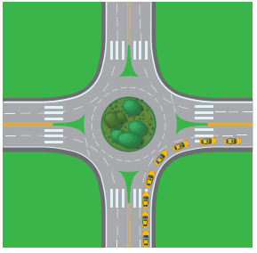 Overhead view of yellow car making a right turn at a roundabout.